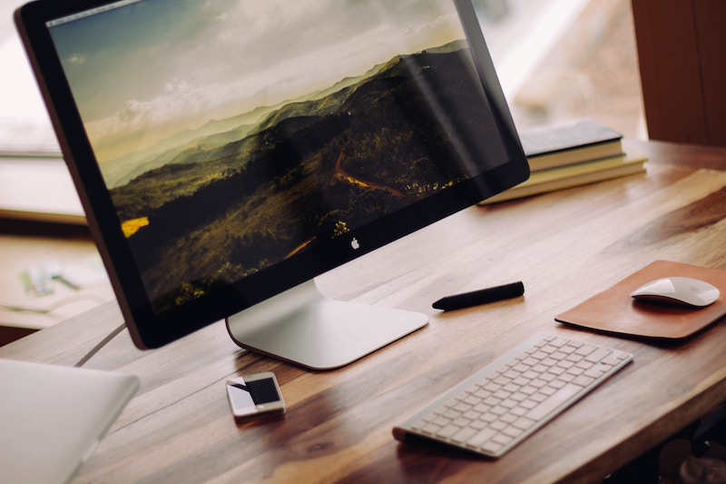 Computer on a wooden desk